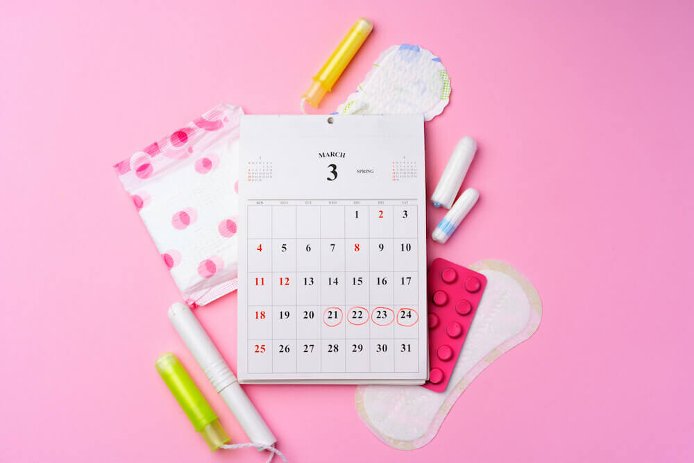 Irregular periods calendar with female menstrual hygienic items
