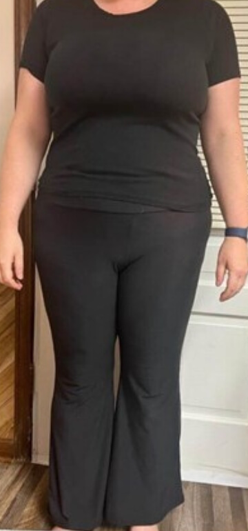 PCOS Sisters A woman wearing black clothes standing in front of a door before her Weight Loss Journey PCOS.