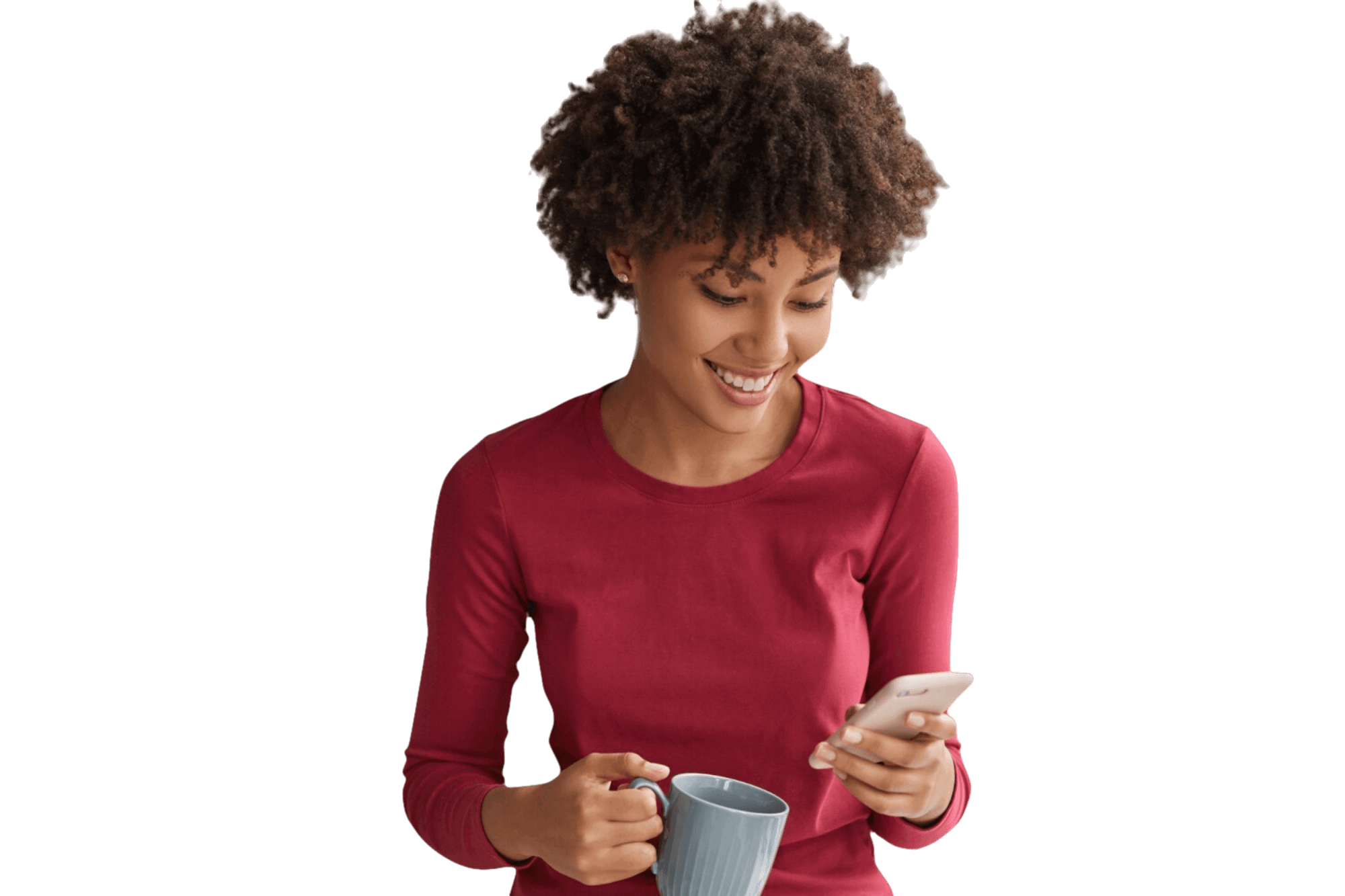 Young afro american woman in red shirt with a coffee mug in hand looking on her phone